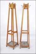 A good pair of mid century oak tapering Industrial office - school staff room hat - coat stands.