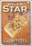 A vintage early 20th century Industrial enamel advertising sign for Wills Star Cigarettes.