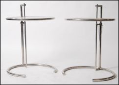 A pair of Eileen Grey style chrome and glass coffee / side occasional tables having glass tiers on