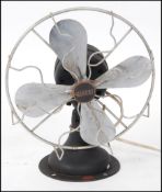 A vintage early 20th century Industrial desk fan by Gilbert.