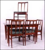 A 1960's G- Plan teak dining table and 6 chairs believed Danish designer IB Kofod Larsen.