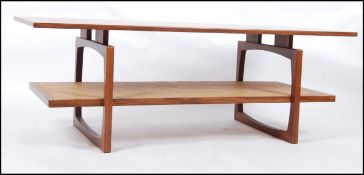 A rare 1970's large G-Plan teak and rattan weave rectangular coffee table having shaped supports