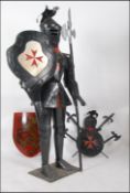 A Masonic suit of armour shop display/advertising piece with shield and pike,