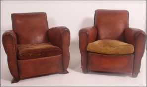 A good pair of 1930's Art Deco French leather club / chesterfield armchairs having barrel arms and