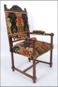 A 19th century French Armorial walnut throne chair upholstered in a stunning believed original