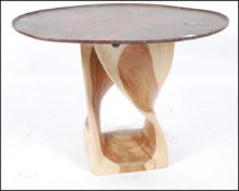 A 20th century upcycled copper and carved wooden garden table / conservatory table.