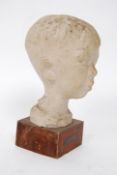 A plaster study sculpture of a boys head on socle plinth marked for Lorenze Pepe - Liloceramica .