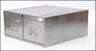 A polished steel mid century Industrial factory 2 drawer desk top filing index cabinet.