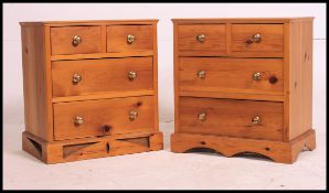 A pair of pine bedside chests of drawers