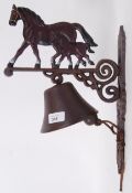 A 20th century cast iron bell with decor