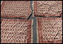 A collection of four matching floor rugs