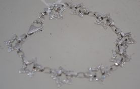 A 9ct white gold star linked ladies brac