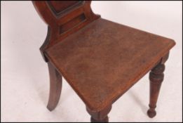 A Victorian mahogany hall chair raised o
