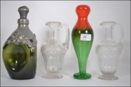 Pair of cut glass, handled decanters of