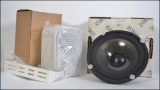A pair of boxed Loud Speakers one being