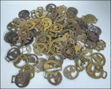 A large collection of 19th and 20th century horse brasses to include many examples some being cast,