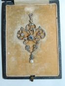An early 20th century white metal Belle Epoque pendant set with rose cut diamonds with central