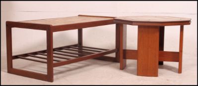 A 1970's retro teak and tile top coffee table of rectangular form raised on splayed legs 40cm high