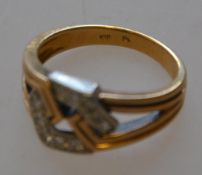A marked 18ct diamond ring with geometr