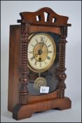 A continental carves wooden mantle clock with enamel face roman numeral chapter ring,