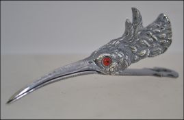 A silver plated clip in the form of a wa