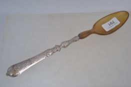 A silver and horn large table serving sp