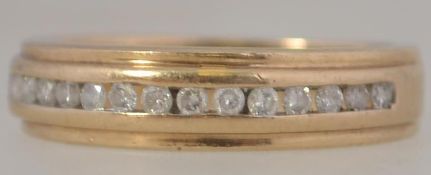 A 9ct gold and diamond ladies channel se