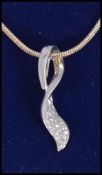 A white gold diamond drop pendant neckla