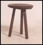 A Victorian arts and crafts oak 3 leg st