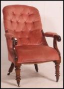 A Victorian mahogany armchair being rais