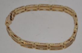 A 9ct gold ladies designer bracelet bein