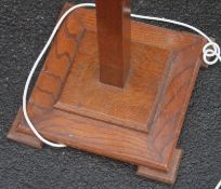 A 1930's Art Deco oak standard lamp with