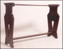 An unusual 19th century Arts & Crafts mahogany eclesiastical bench table raised on pierced lyre