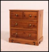 A good pine bedside chests of drawers of