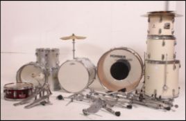 A harlequin ten piece drum kit consistin