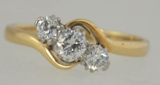 An 18ct gold and Platinum diamond trilogy ring set with three good diamonds a total of approx 50pts.