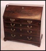 A Georgian mahogany bureau, the hinged t