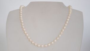A 9ct gold and pearl necklace from Nicholas Wylde. Brand new, unused, within the original box.
