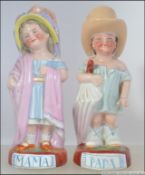 A pair of continental 19th century German porcelain figurines of children in dressing up clothing.