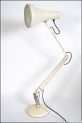 A 1970's Herbert Terry anglepoise desk lamp in the original white paint with circular base and