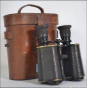A cased set of Ross of London binoculars complete in the leather case.