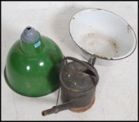 A vintage industrial mid 20th century enamel pendant light shade along with a enamel bowl and