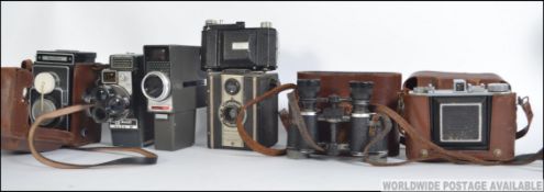 A collection of cameras to include a leather cased Zeiss Ikon camera together with others ( see