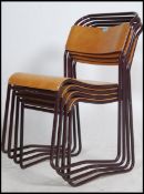 A set of four vintage mid 20th century church / village hall stacking chairs.