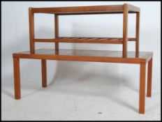 A pair of retro 1970's teak tiled topped coffee tables.