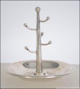 A silver hallmarked ring stand come pin dish with rubbed marks. Weight 34.9g. Measures 9cm high.