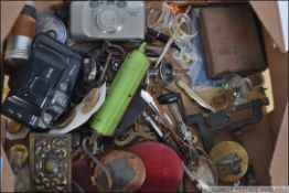 A mixed lot to include vintage scales, matchbox holders, cameras and various objects.