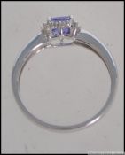 An 18ct white gold and tanzanite ring having a cushion cut tanzanite stone approx 0.