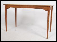 A 1920's golden oak Air Ministry library - writing table desk being raised on squared tapering legs