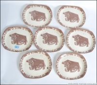 A collection of seven retro Picasso inspired transfer printed steak plates having a central bull